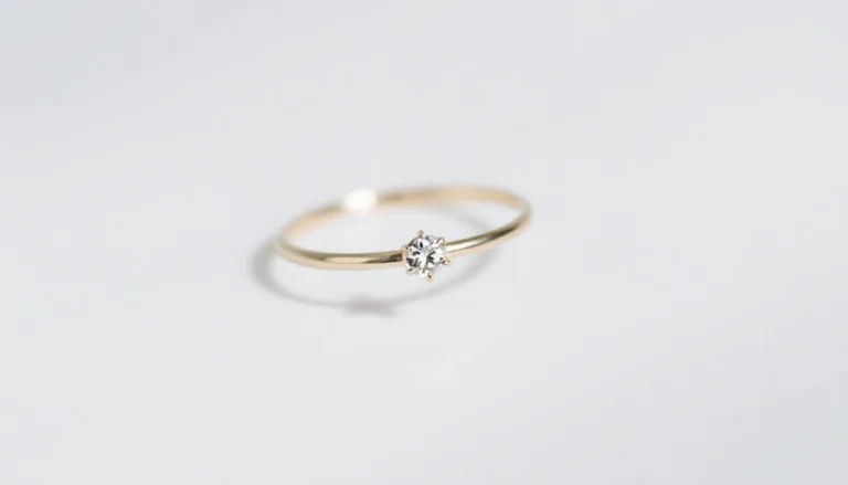 Minimalist engagement rings featuring slim gold bands with single small diamonds, perfect for everyday wear.